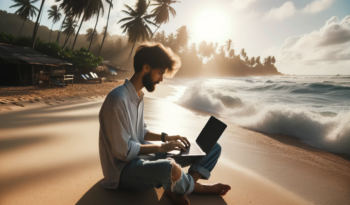 Digital Nomand arbeitet mit seinem Laptop direkt am Strand